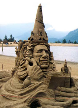 Abstract sculpture of a man's upper body reading a book