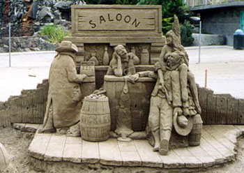 Sculpture depicting four people near a bar in a saloon