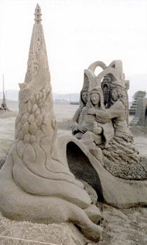 Group of four people staring intently at an obelisk