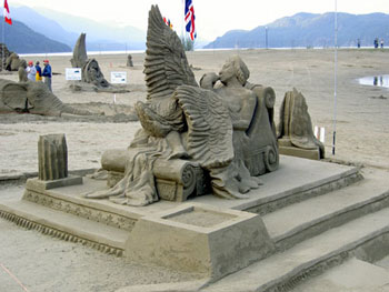 Sculpture of a women sitting beneath an arc that bears two crosses at its base
