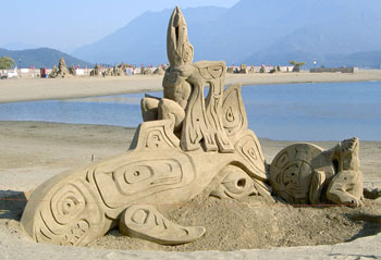 Abstract sculpture of a being riding on top of a whale