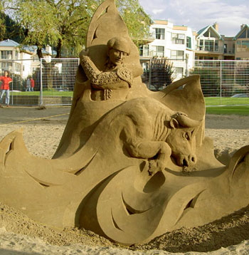 Abstract sculpture of a bull, ocean waves, and a man