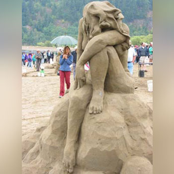 Sculpture that appears to show a despondent women resting her head on her left knee