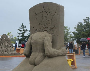 Sculpture of a man who has smashed his head into a wall