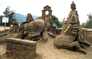 Sculpture of a beach featuring people, a boey, and an octopus