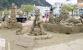 Sculpture of non-human beings at what appears to be a banquet