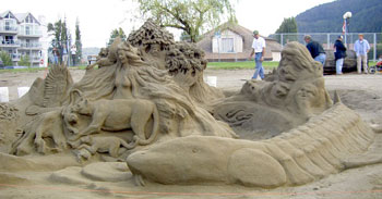 Abstract sculpture of several animals, a woman, and a man